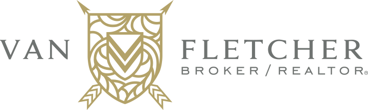 Van Fletcher Broker Logo - Dark gray serif type with tan stylized shield between words and dark gray sans-serif tagline
